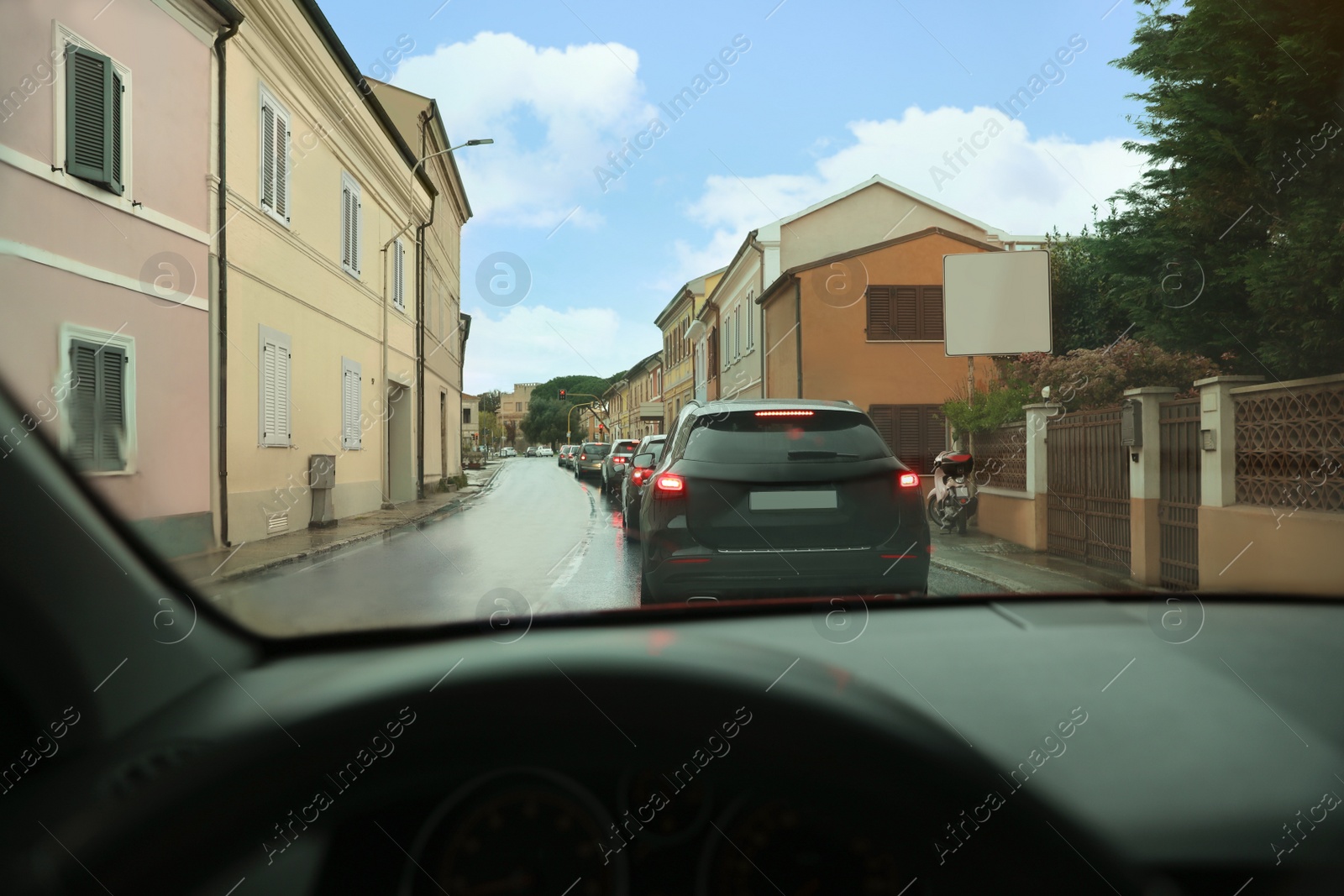 Photo of Cars in traffic jam on city street, view from driver's seat