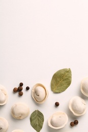 Photo of Composition with raw dumplings, bay leaves and pepper, top view