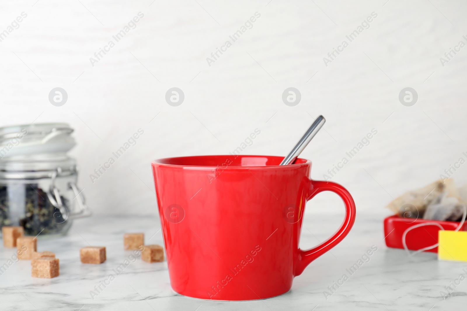 Photo of Cup of delicious hot tea on table