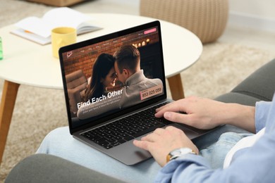 Image of Looking for partner. Man using laptop at home, closeup. Dating site webpage on device screen