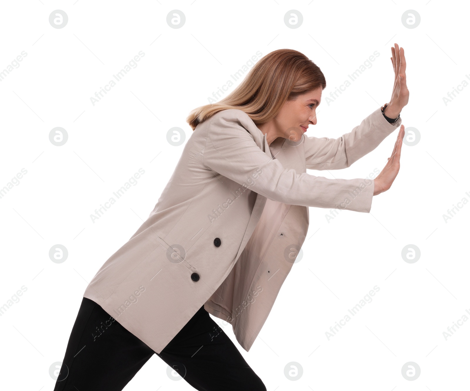 Photo of Beautiful businesswoman pushing something on white background