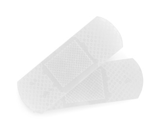 Photo of Medical adhesive bandages isolated on white, top view