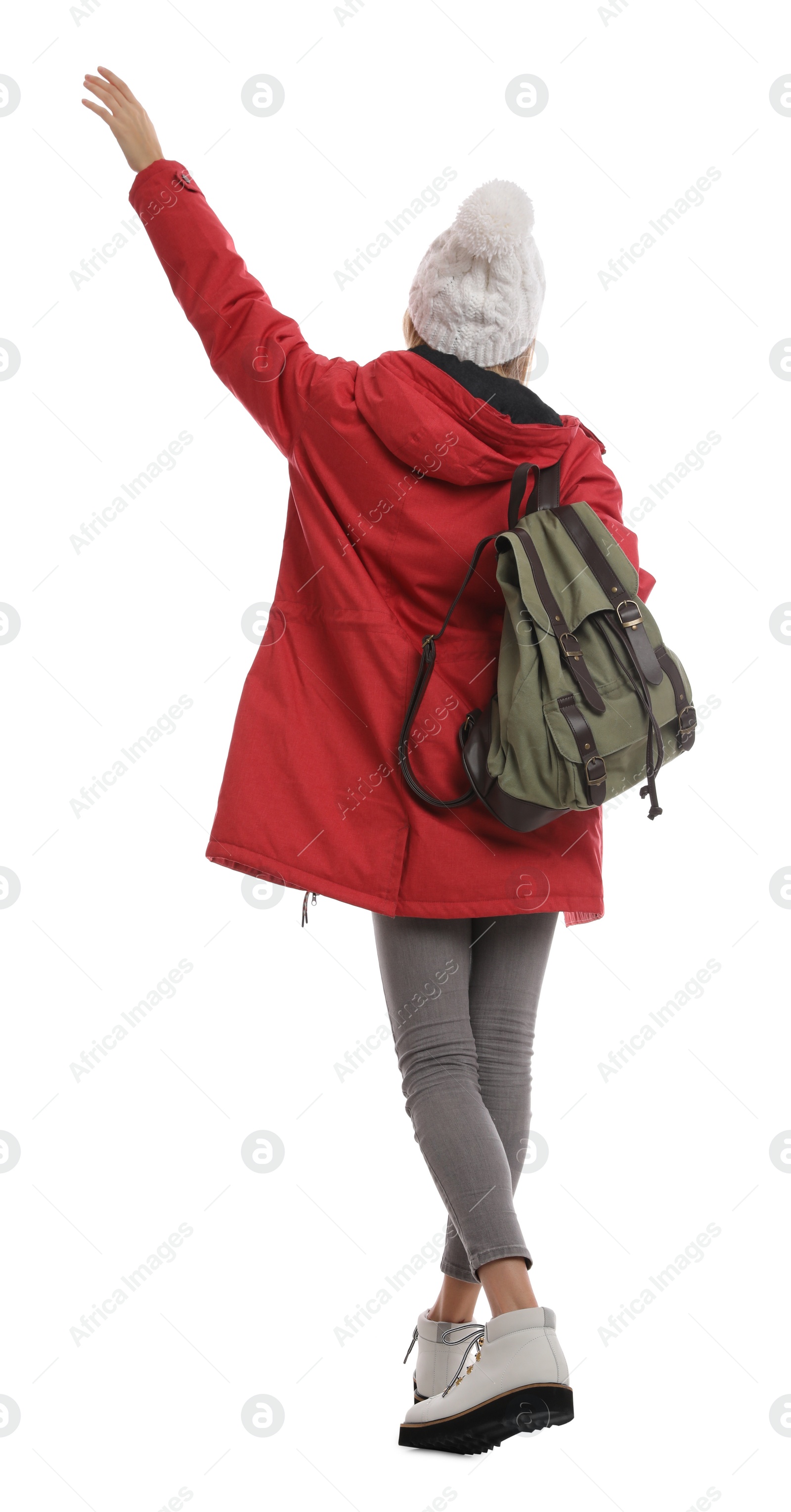 Photo of Woman with backpack on white background, back view. Winter travel