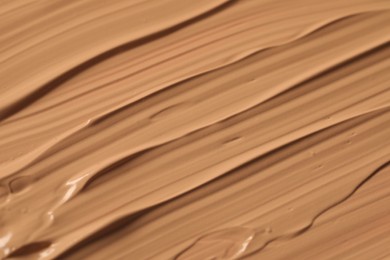 Photo of Texture of liquid skin foundation as background, closeup