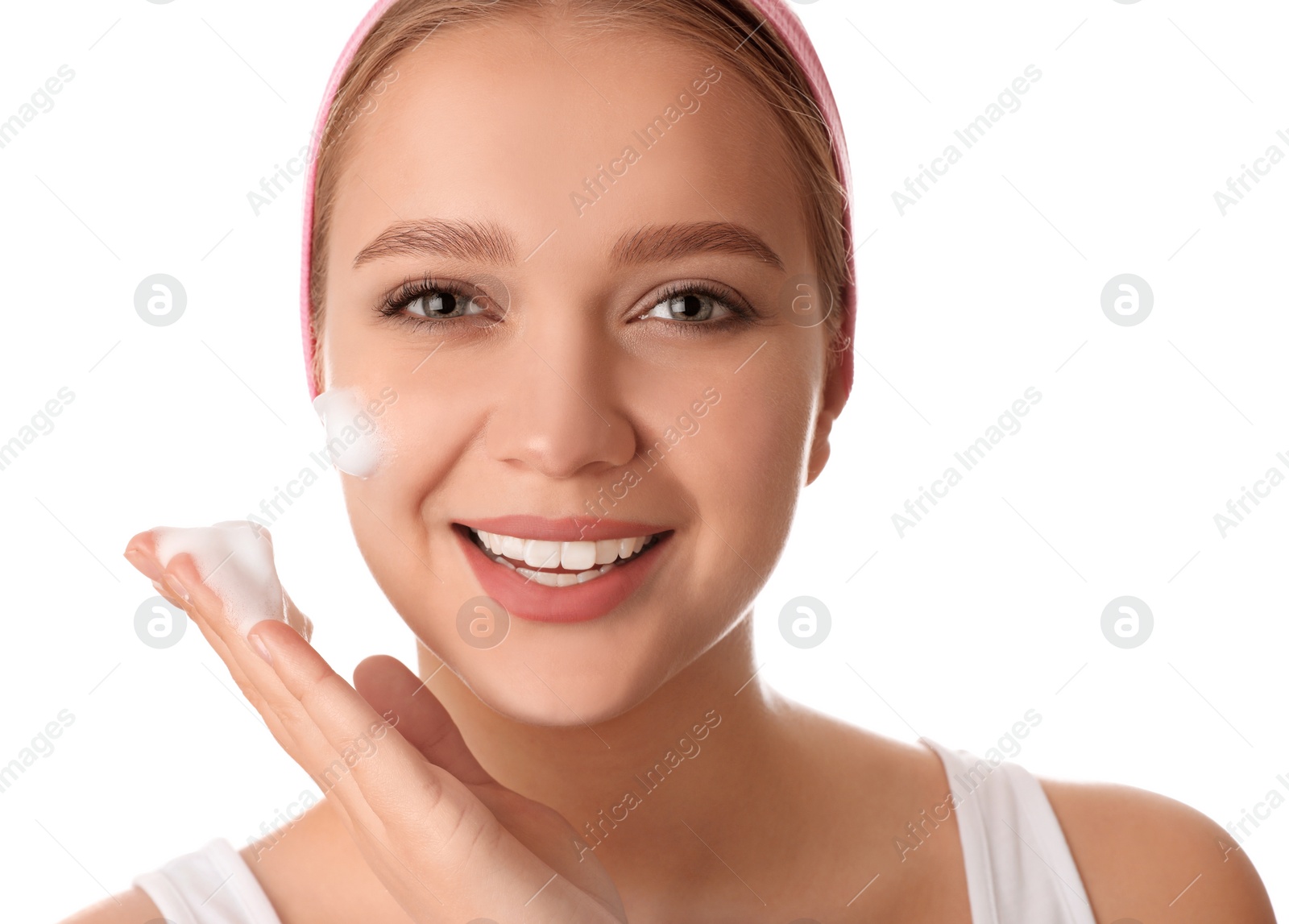 Photo of Young woman washing face with cleansing foam on white background. Cosmetic product