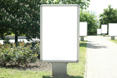 Photo of Blank citylight poster outdoors. Advertising board design