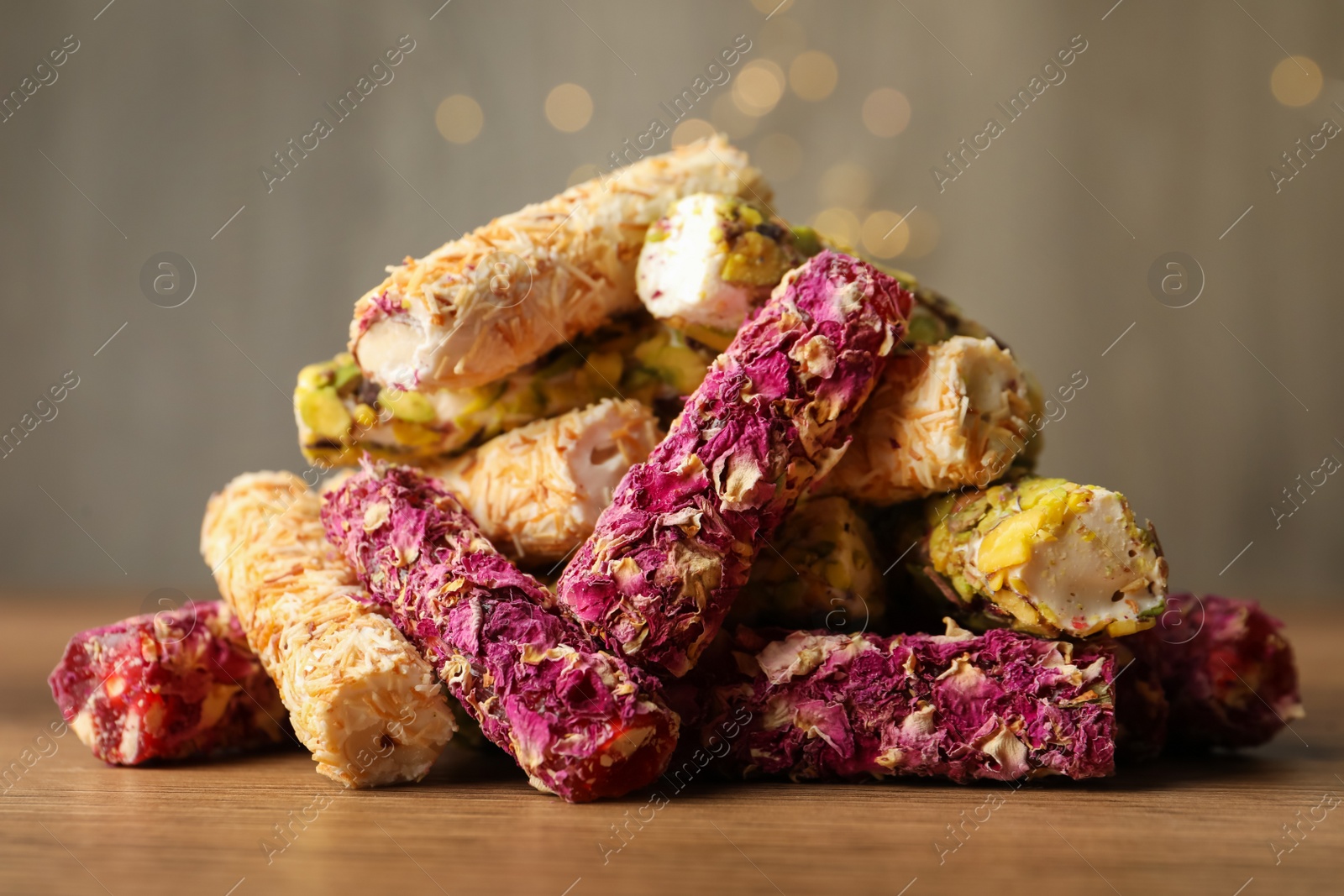 Photo of Turkish delight dessert on wooden table, closeup