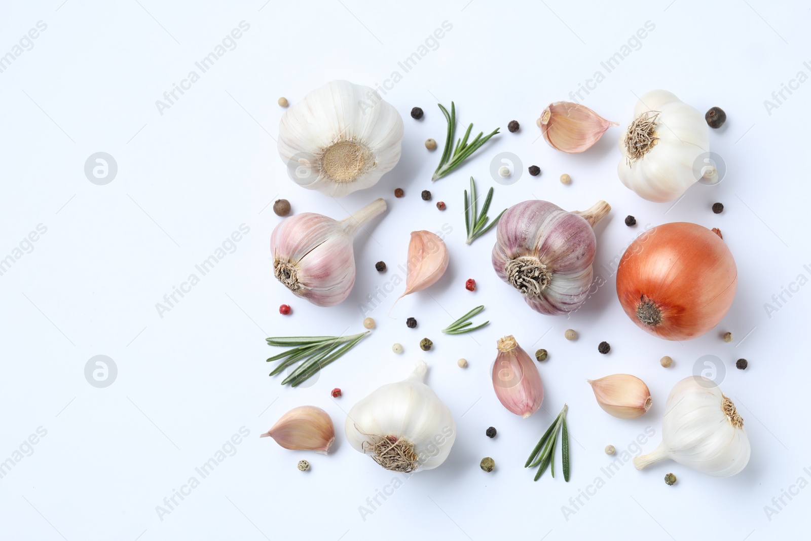 Photo of Fresh garlic, onion, rosemary and peppercorns on white background, flat lay. Space for text