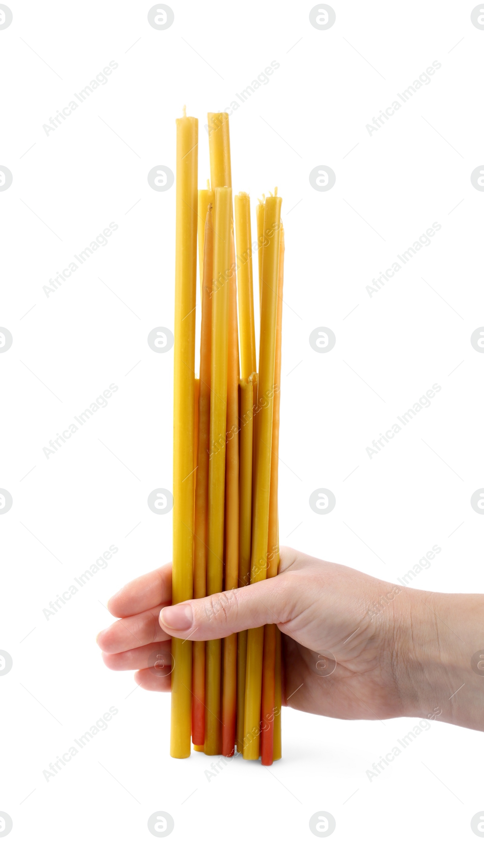 Photo of Woman holding church candles on white background, closeup