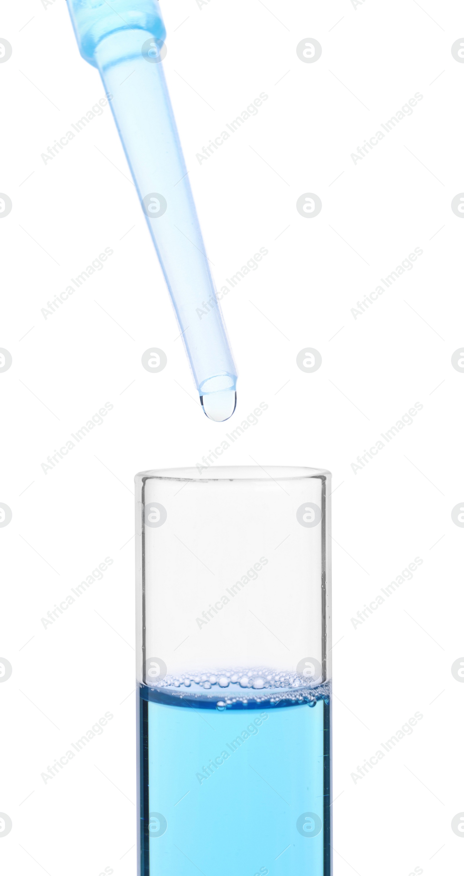 Photo of Dripping liquid from pipette into test tube isolated on white, closeup