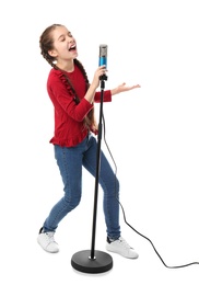 Photo of Cute girl singing in microphone on white background