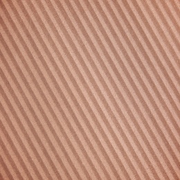 Wall paper design. Brown corrugated sheet of cardboard as background