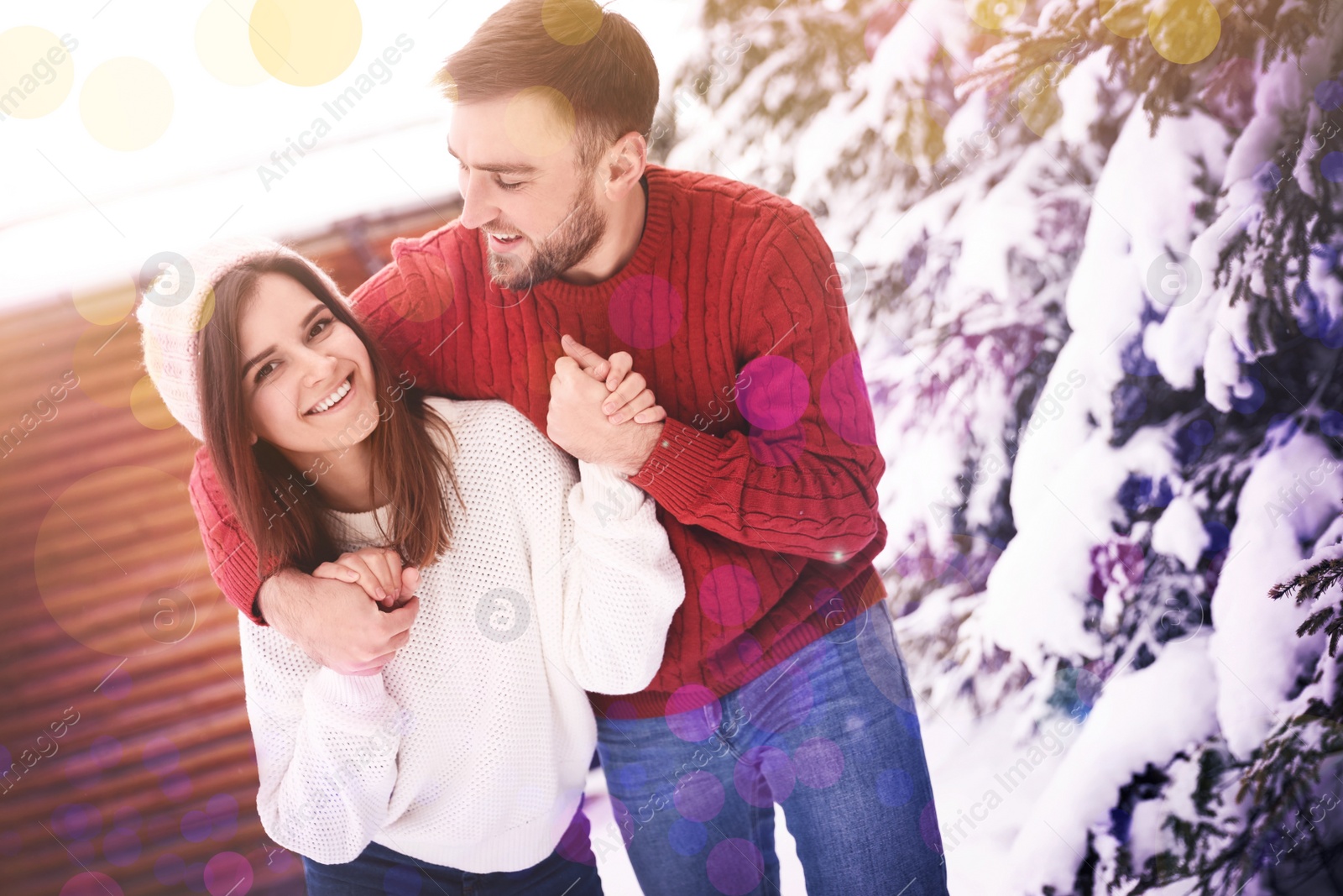 Image of Lovely couple spending time together on snowy day. Winter vacation