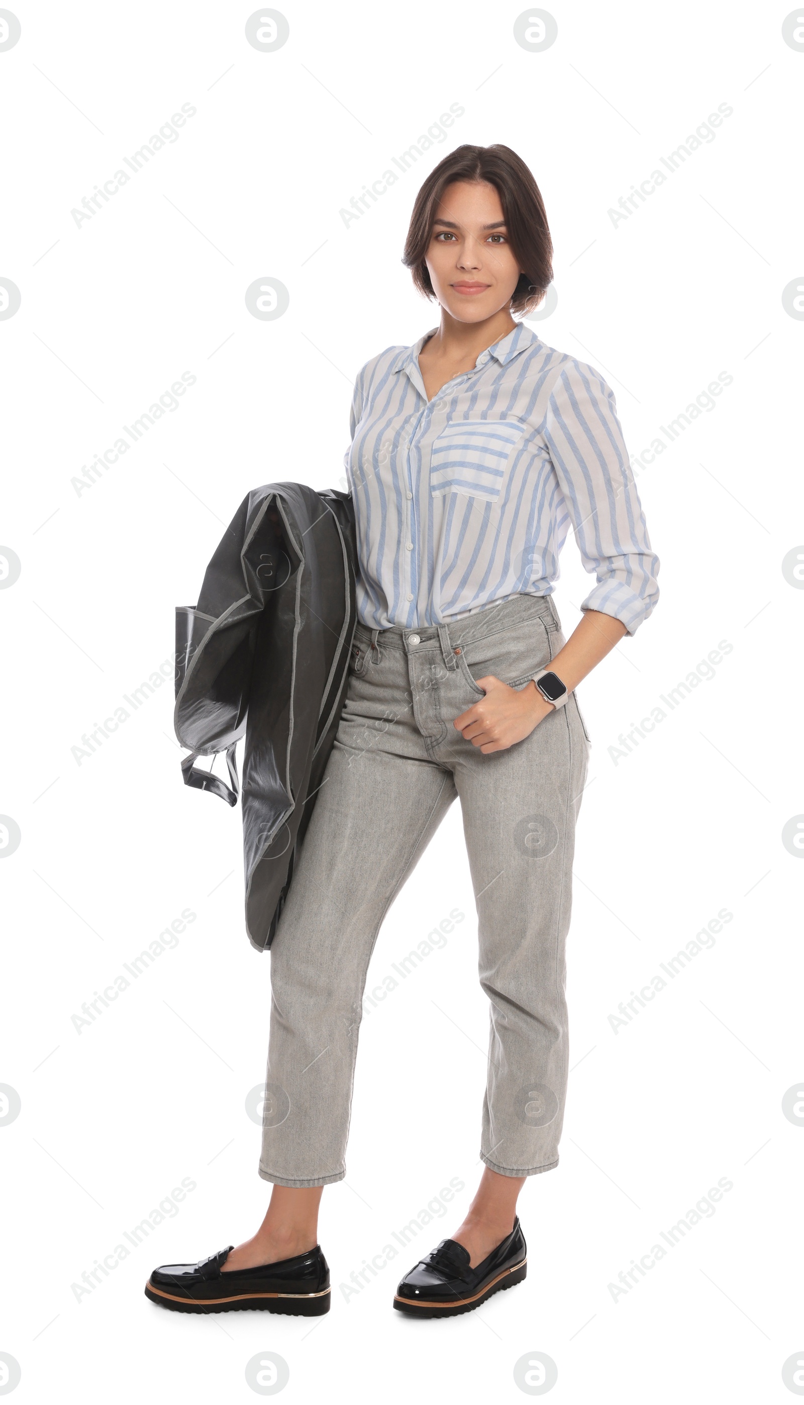 Photo of Woman holding garment cover with clothes on white background. Dry-cleaning service