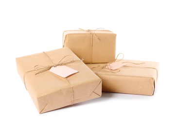 Photo of Parcels wrapped in kraft paper on white background