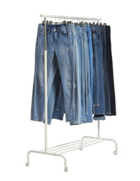 Rack with different jeans isolated on white