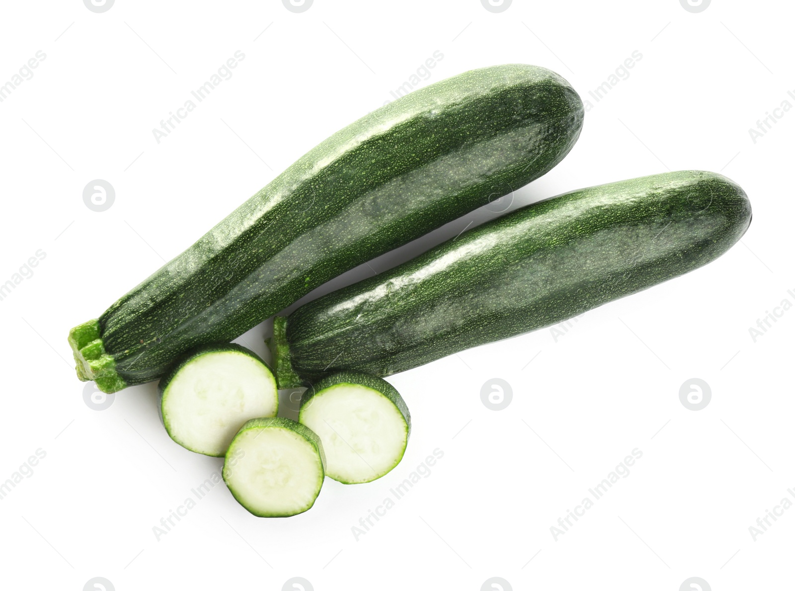 Photo of Fresh ripe green zucchinis isolated on white, top view