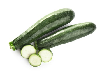 Fresh ripe green zucchinis isolated on white, top view