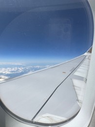 Photo of Beautiful view through plane window during flight. Air travel