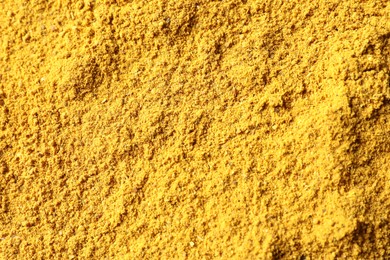 Photo of Dry curry powder as background, top view