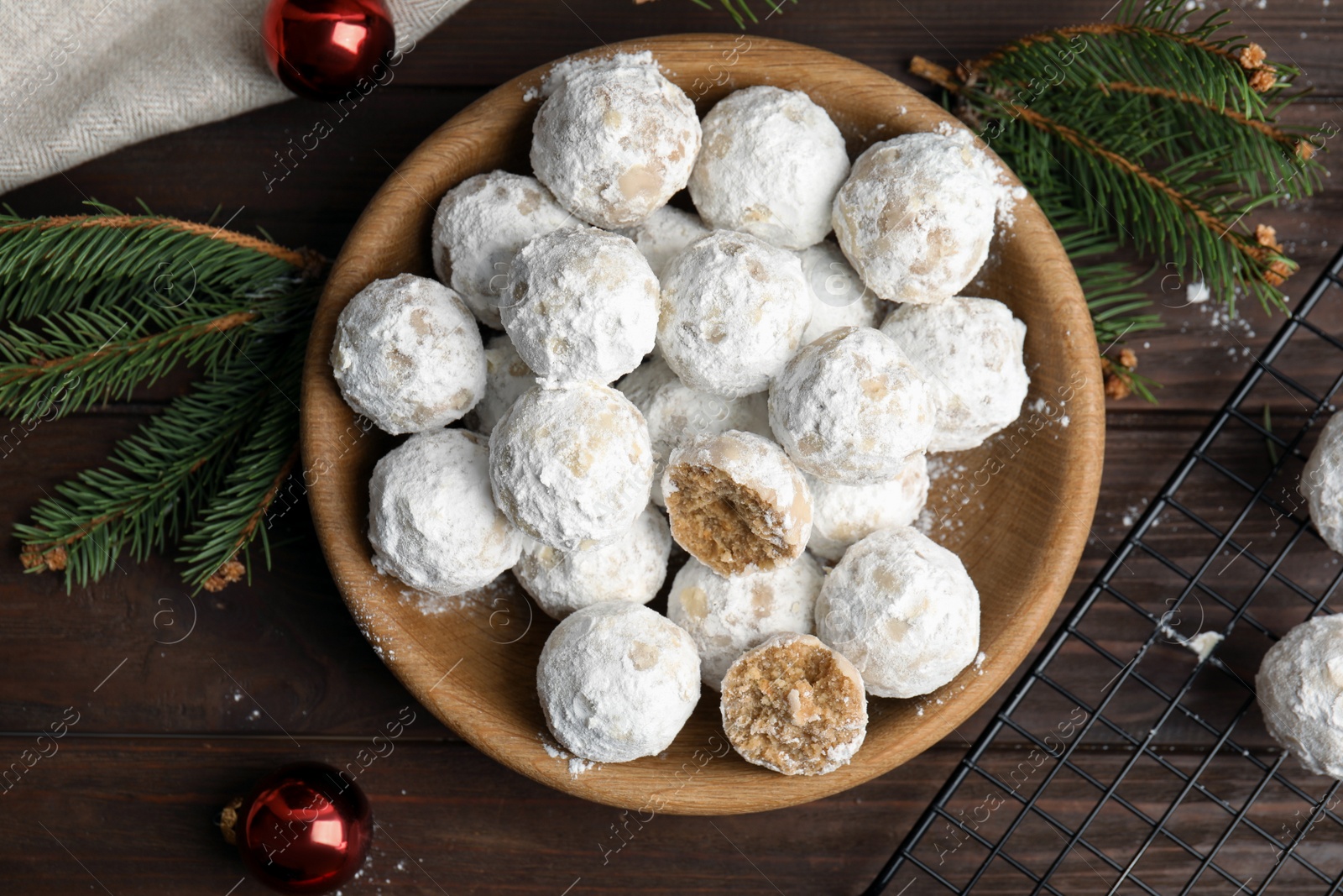 Photo of Flat lay composition with Christmas snowball cookies on wooden table