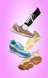 Image of Different sneakers falling on violet gradient background
