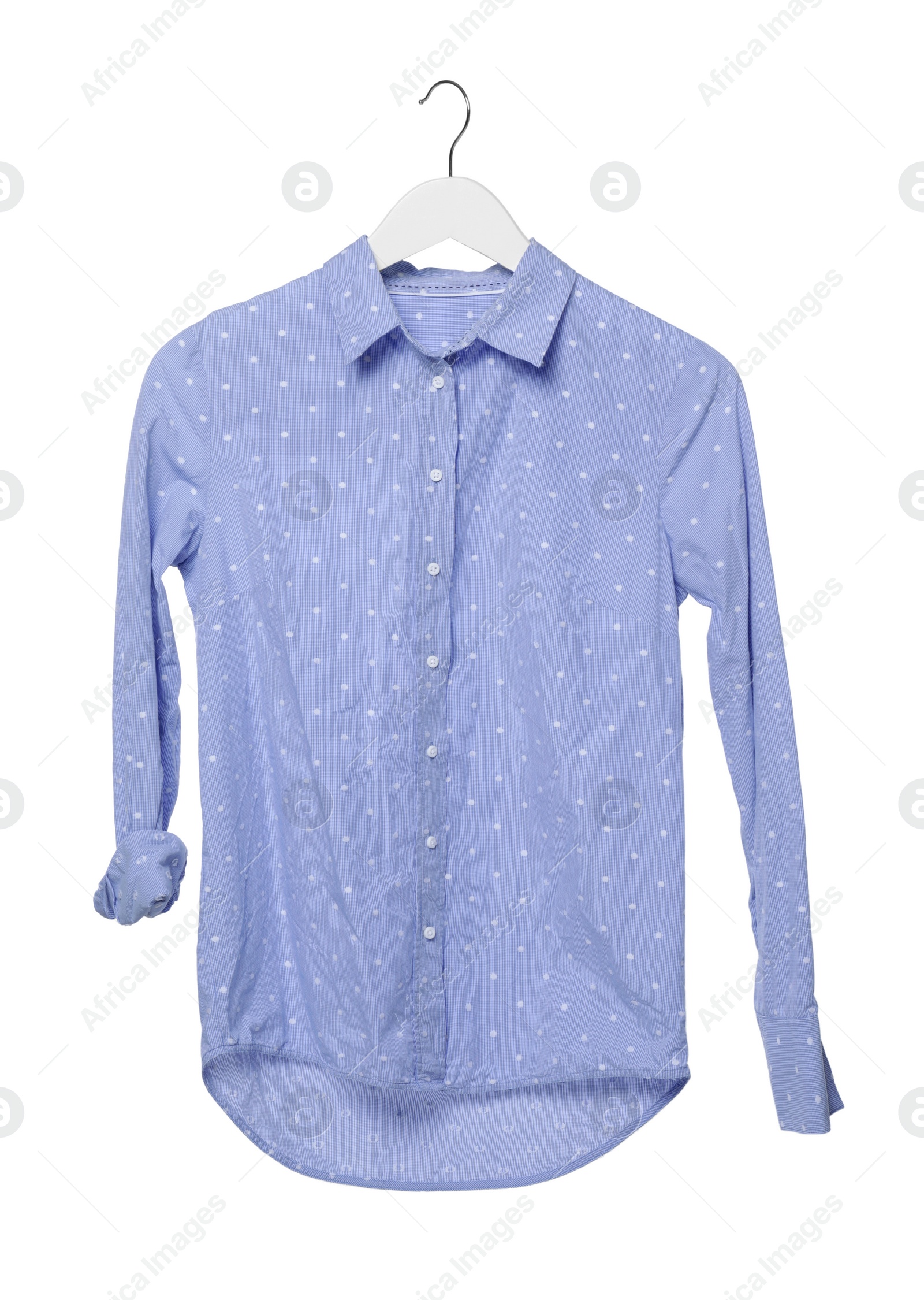 Photo of Crumpled light blue polka dot blouse on hanger against white background