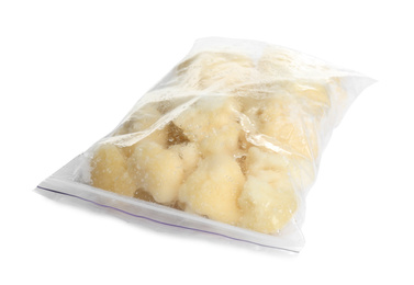 Photo of Frozen cauliflower florets in plastic bag isolated on white. Vegetable preservation