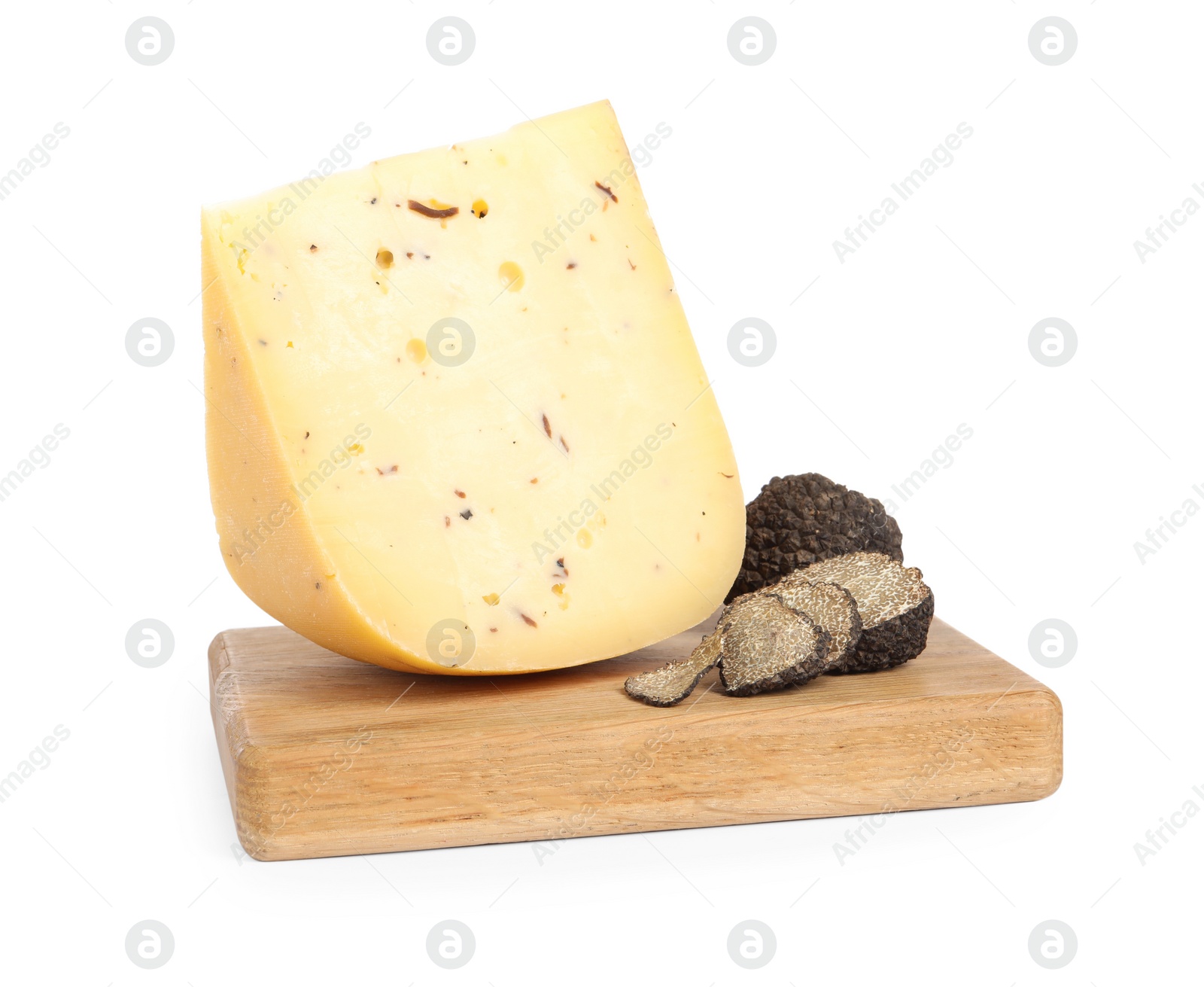 Photo of Wooden board with piece of delicious cheese and fresh black truffles isolated on white