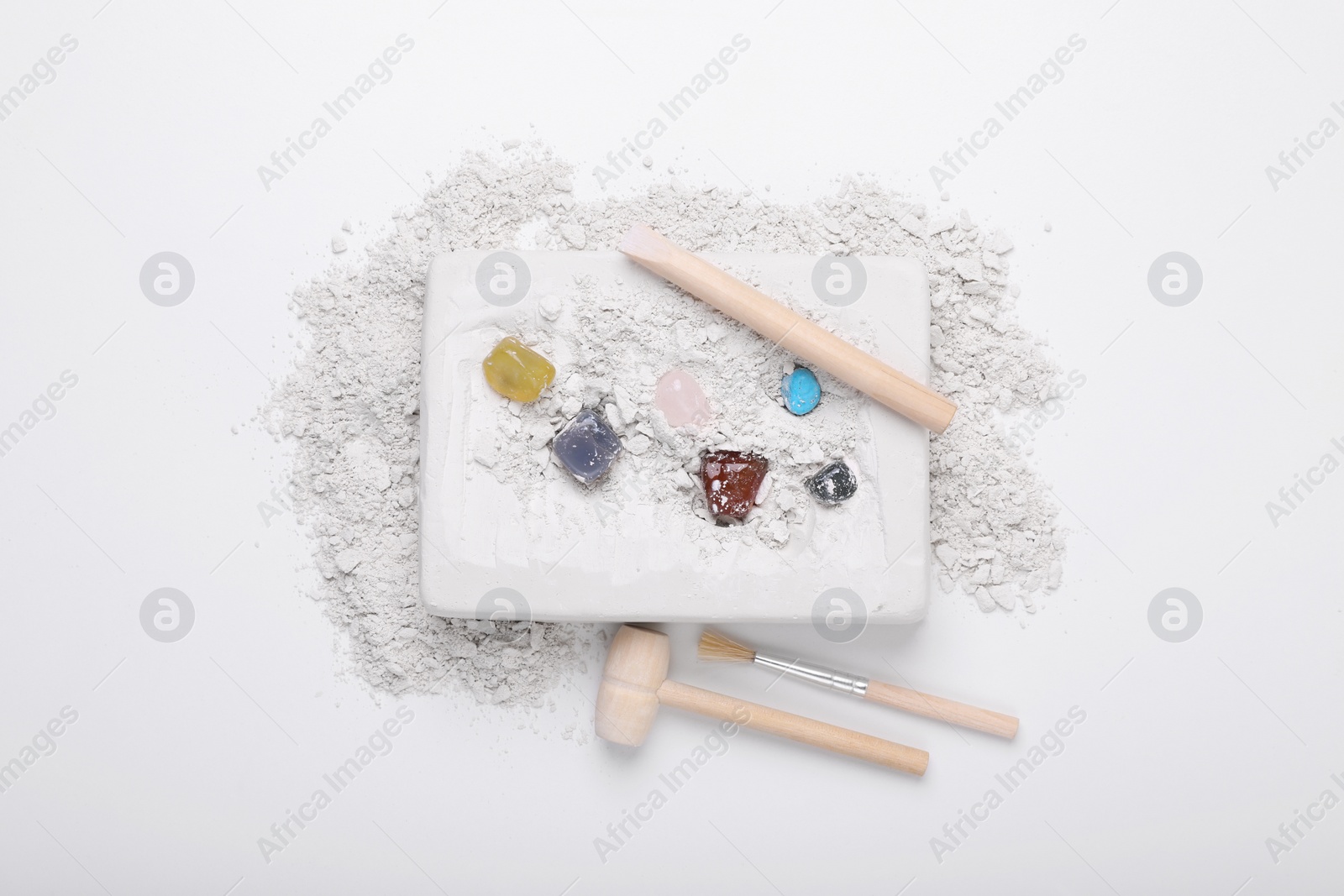 Photo of Excavation kit on white background, top view. Educational toy for motor skills