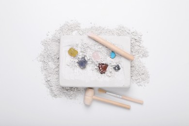 Excavation kit on white background, top view. Educational toy for motor skills