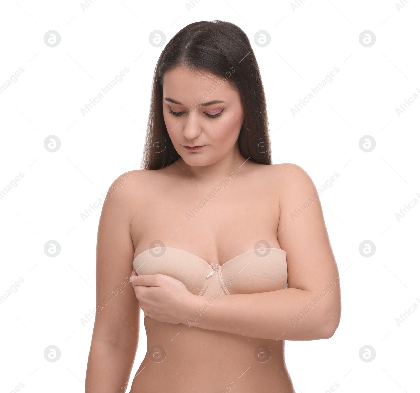 Photo of Mammology. Woman in bra doing breast self-examination on white background