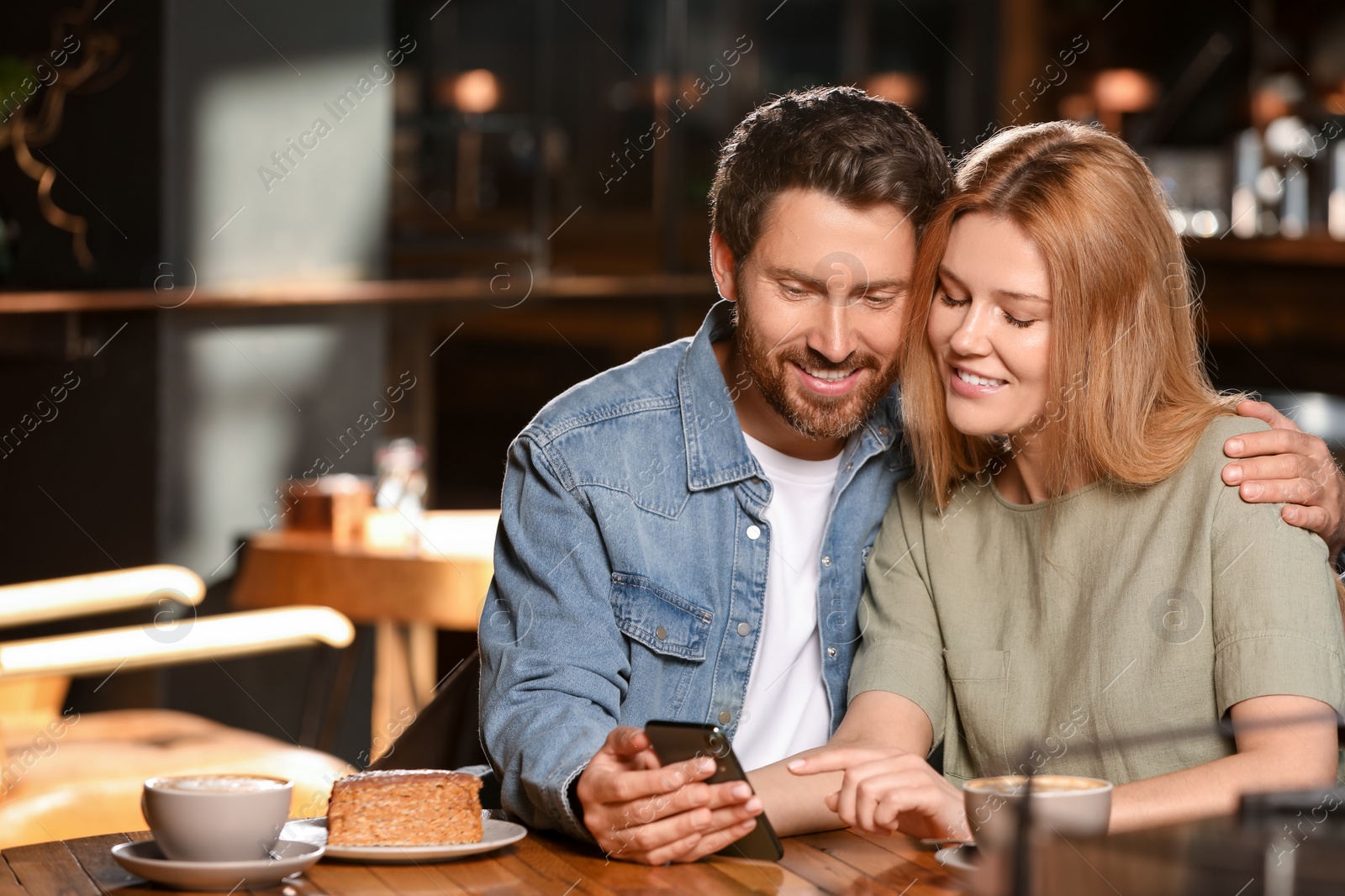 Photo of Romantic date. Lovely couple spending time together in cafe, space for text