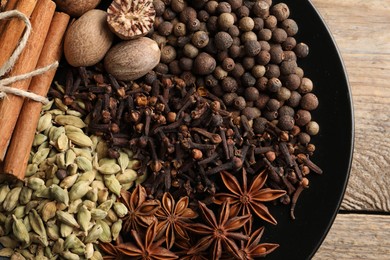 Photo of Different spices and nuts on table, top view