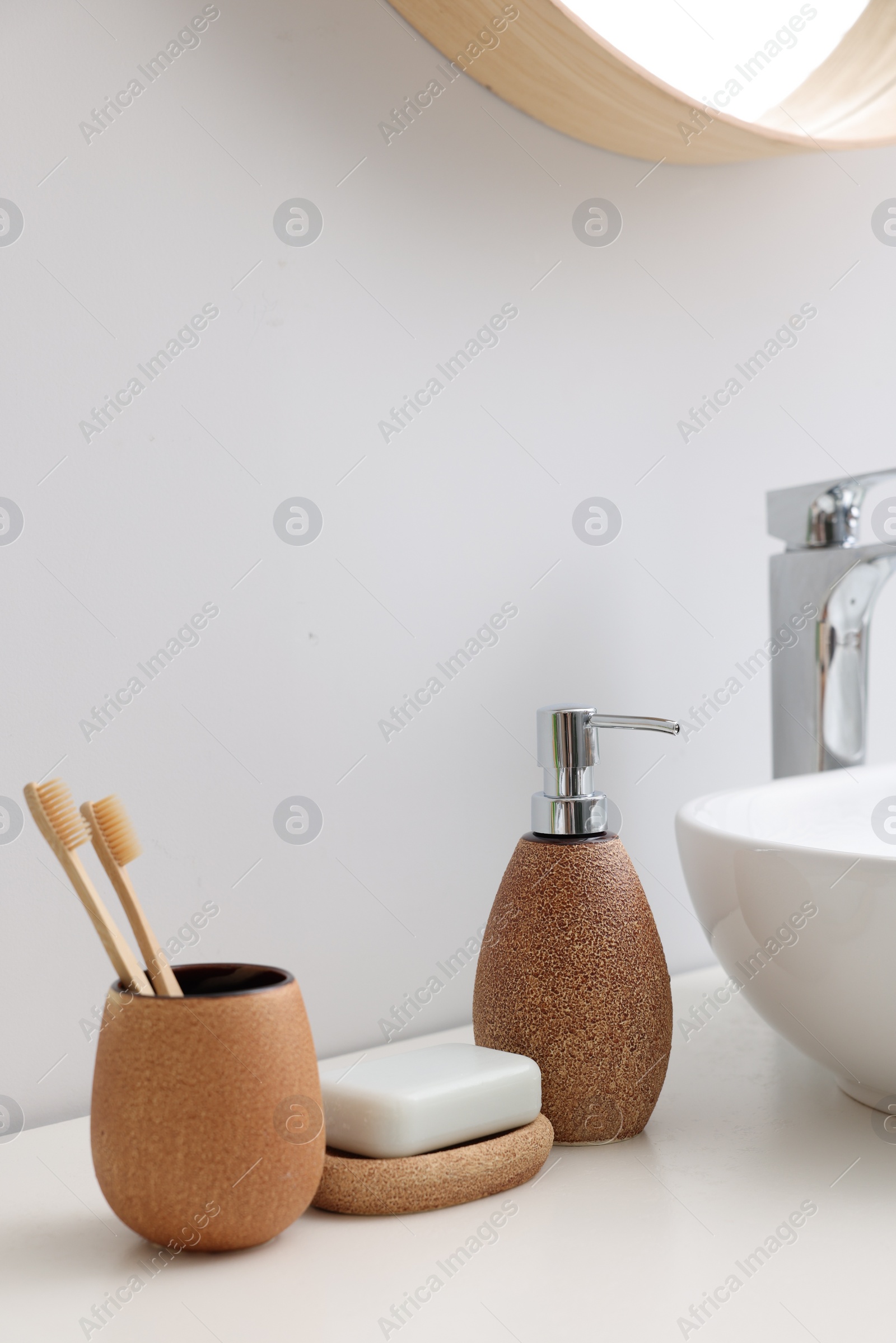 Photo of Set of different bath accessories and products on white table