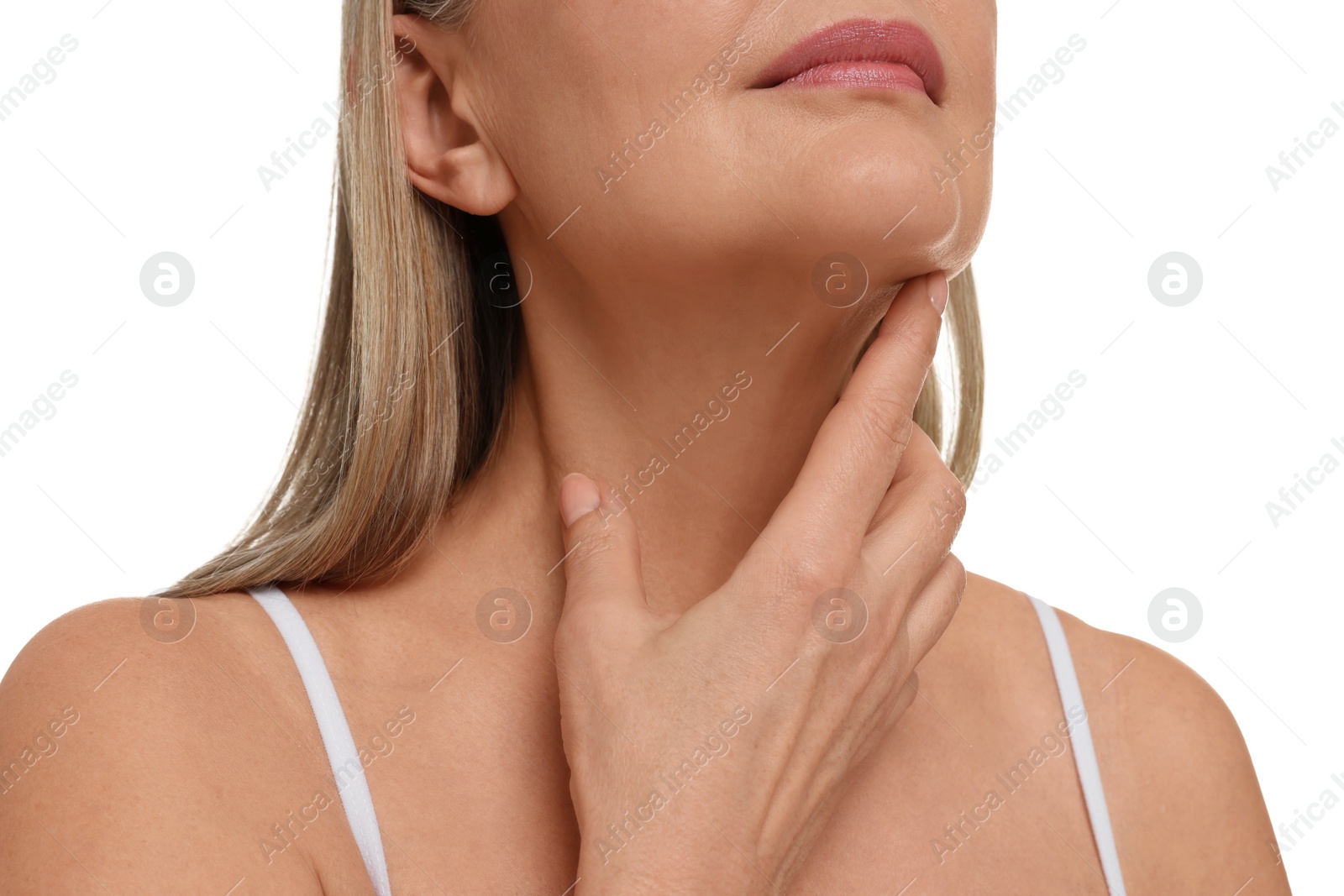 Photo of Mature woman touching her neck on white background, closeup