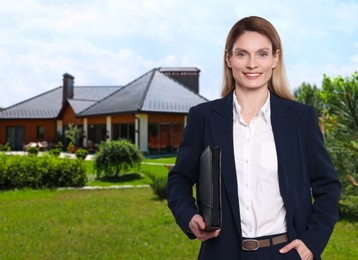 Smiling real estate agent with portfolio near beautiful house outdoors, space for text