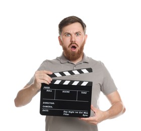 Making movie. Surprised man with clapperboard on white background