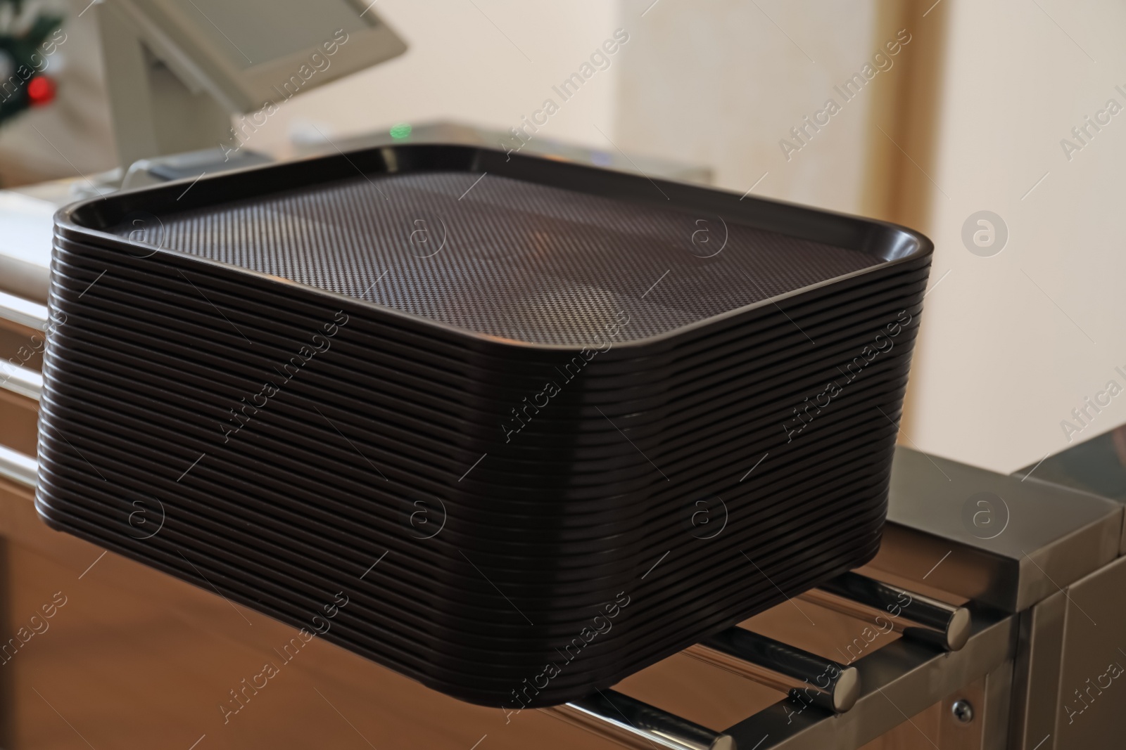 Photo of Stack of plastic trays for food in school canteen