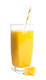 Glass of tasty mango smoothie and fruit slice on white background