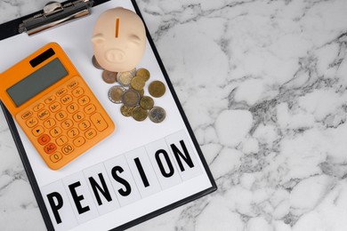 Photo of Calculator, piggy bank, coins and clipboard with word Pension on white marble table, top view and space for text. Retirement concept