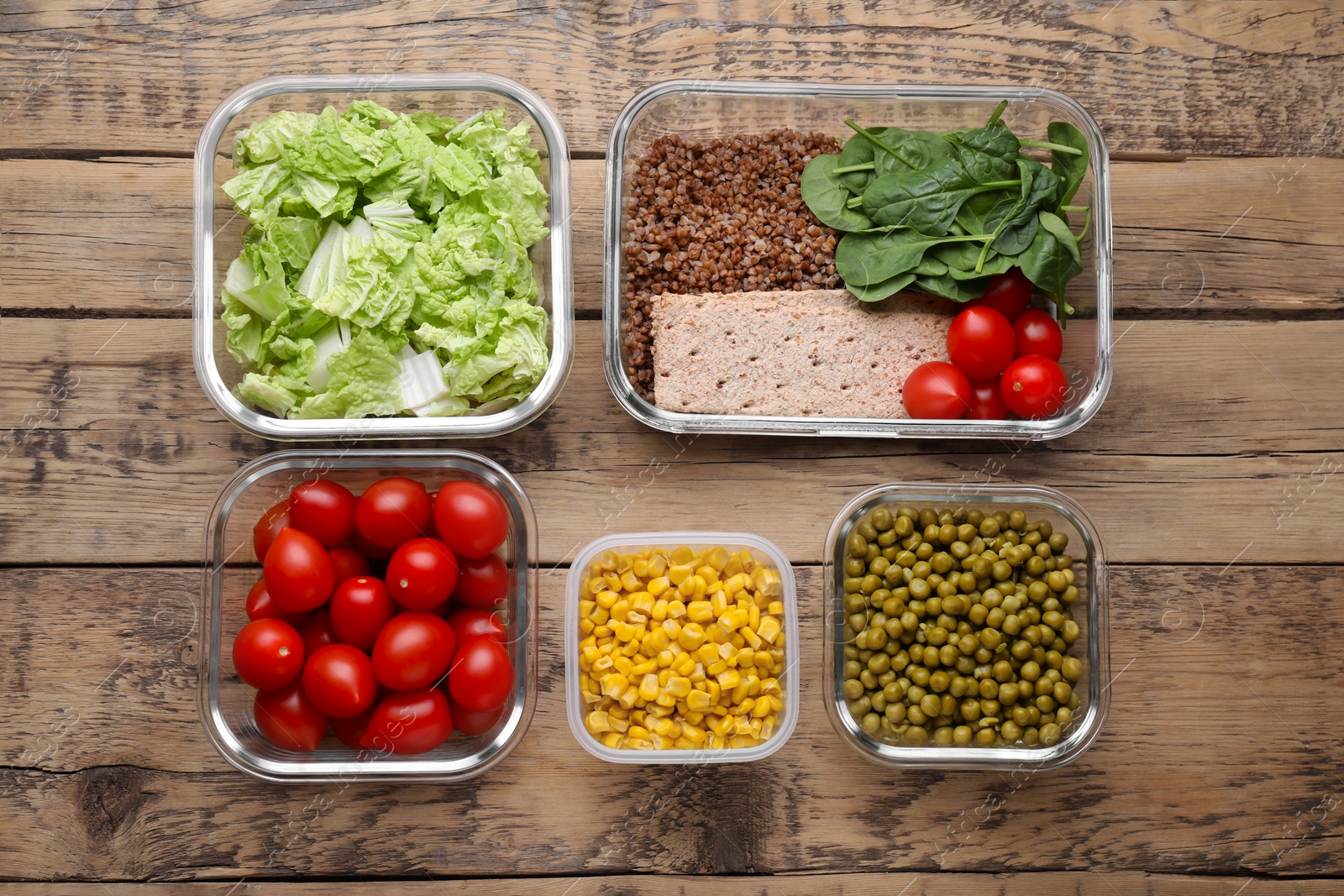 Photo of Plastic and glass containers with different fresh products on wooden table, flat lay