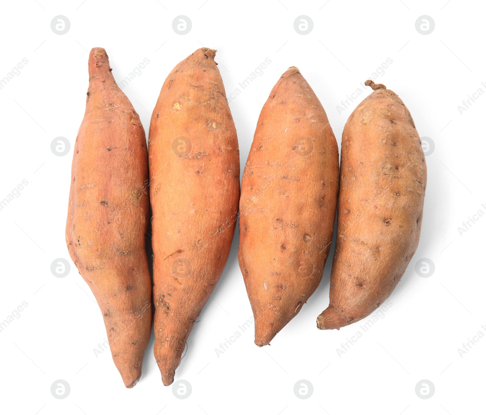 Photo of Heap of whole ripe sweet potatoes on white background, top view