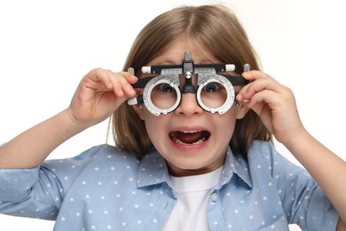 Photo of Vision testing. Little girl with trial frame on white background