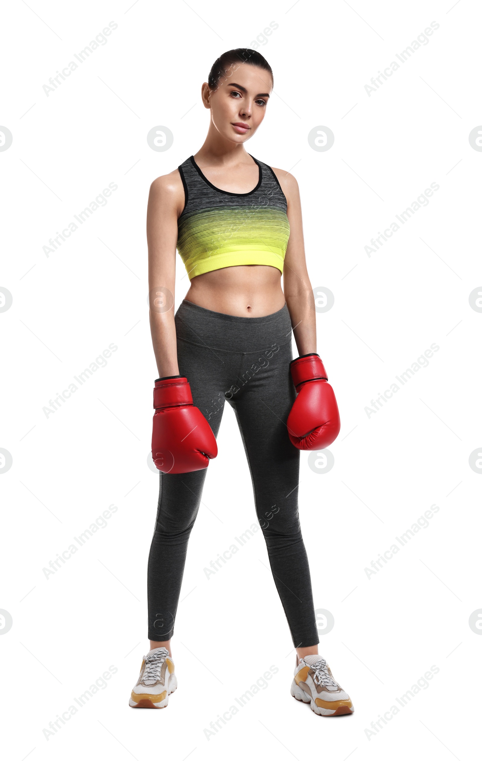 Photo of Beautiful woman in boxing gloves on white background