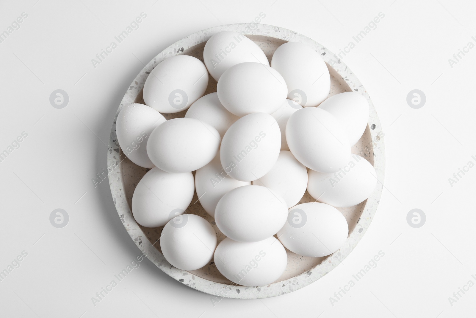 Photo of Fresh chicken eggs on white background, top view