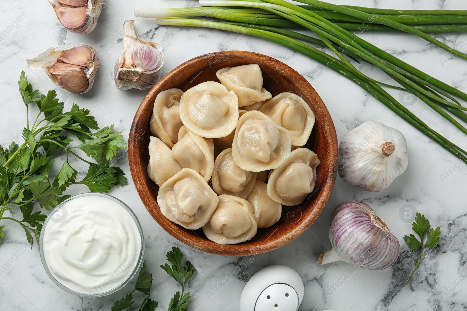 Photo of Flat lay composition with tasty dumplings on marble table