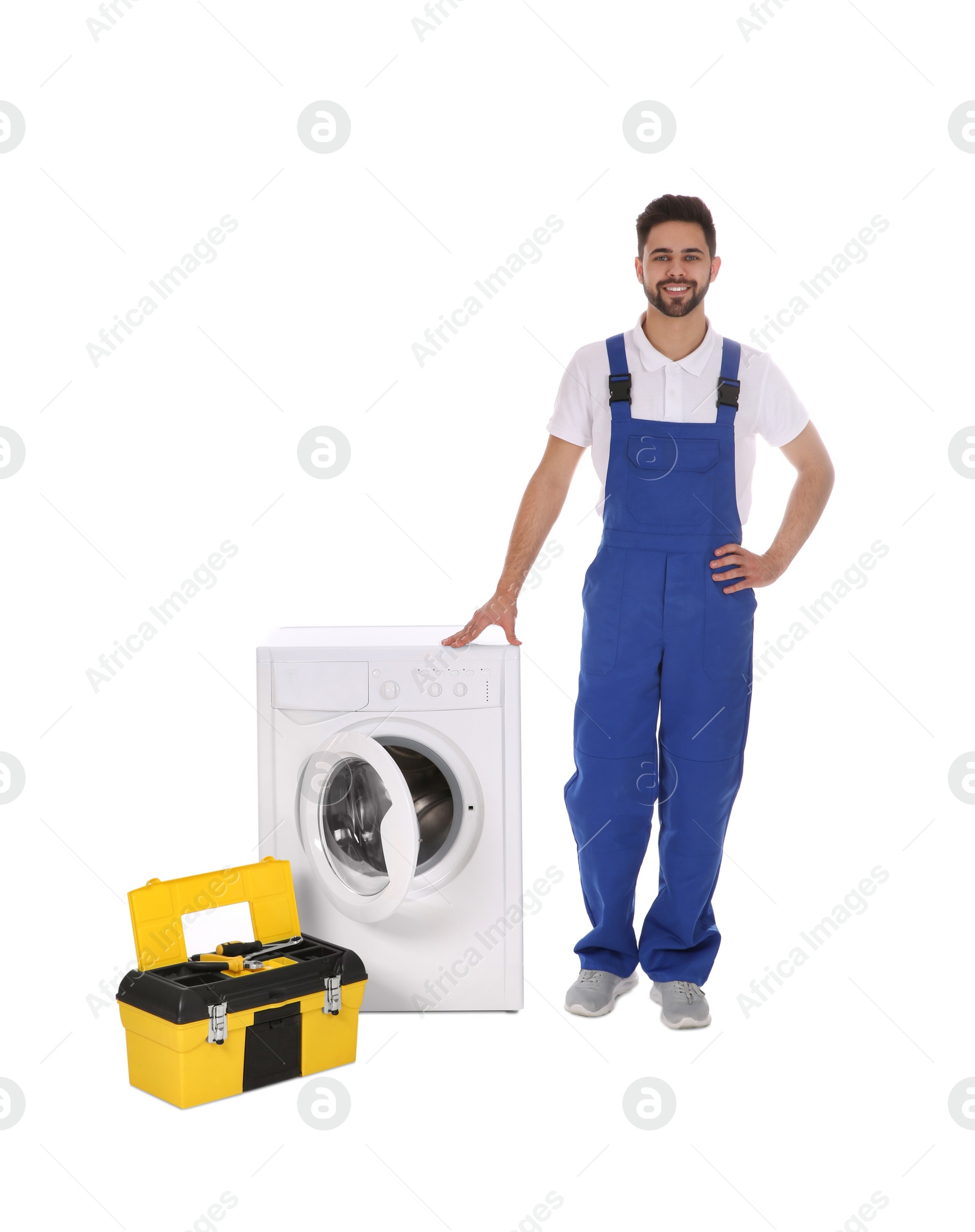 Photo of Repairman with toolbox near washing machine on white background