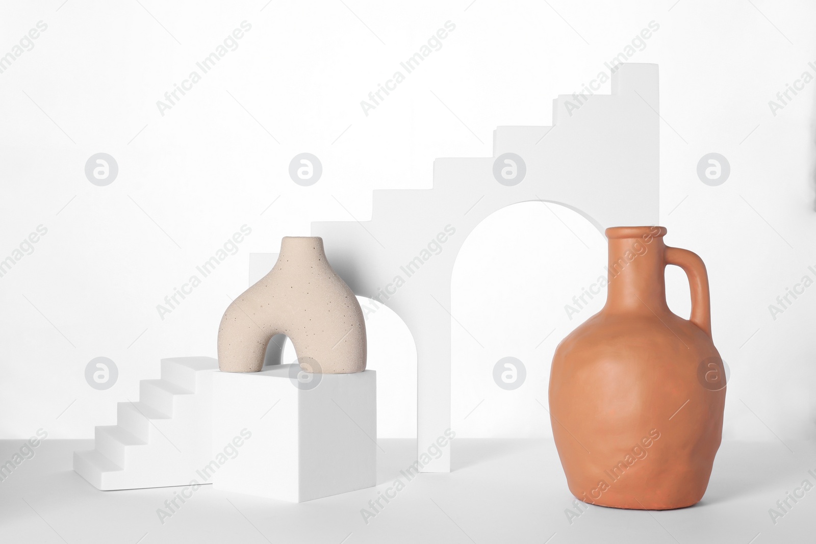 Photo of Clay flagon and decorative elements on white background