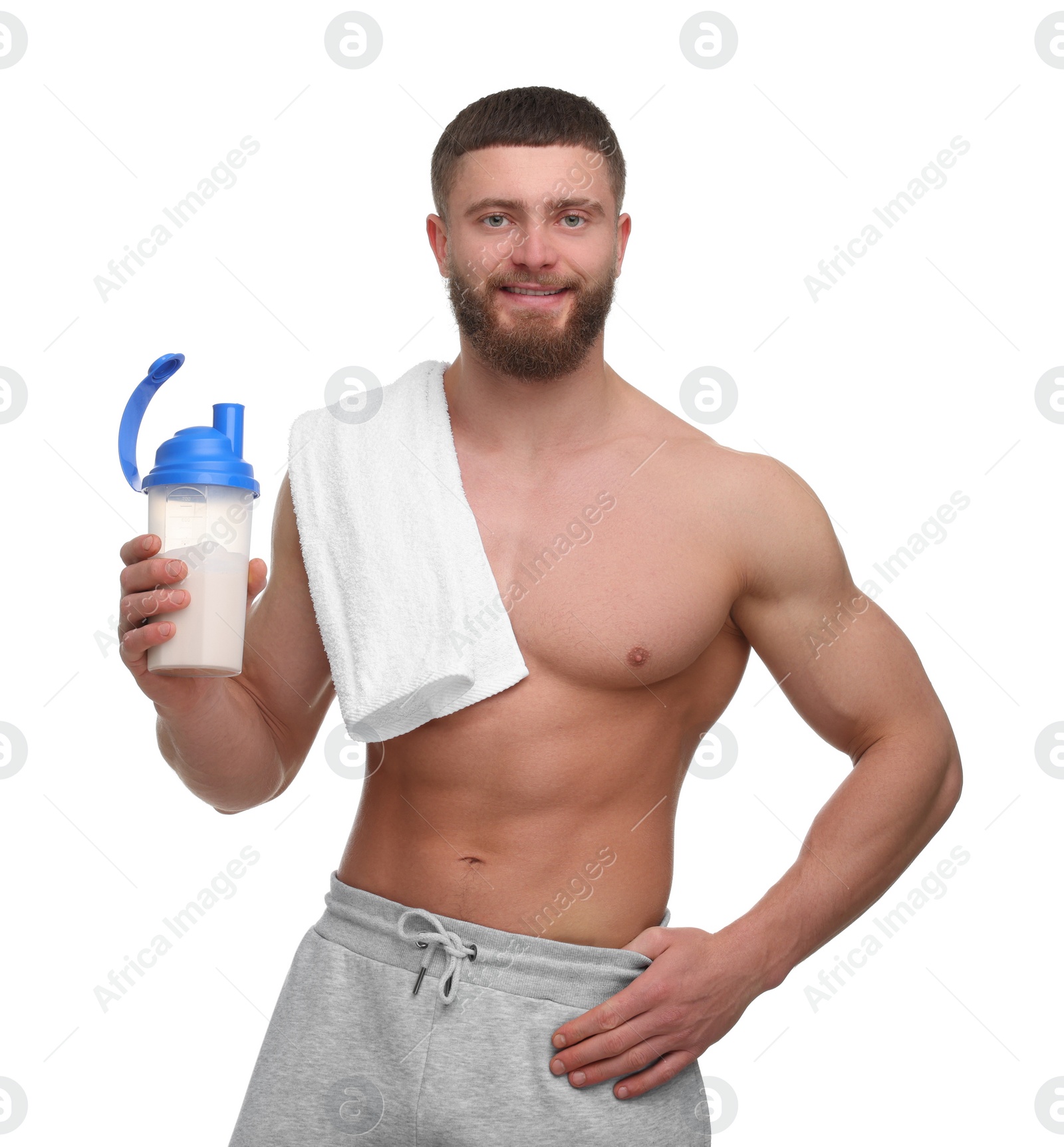 Photo of Young man with muscular body holding shaker of protein and towel on white background